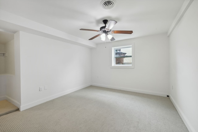 carpeted empty room featuring ceiling fan