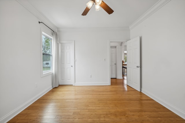 unfurnished bedroom featuring ceiling fan, light hardwood / wood-style floors, and ornamental molding