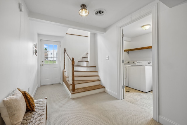 interior space with washer and clothes dryer