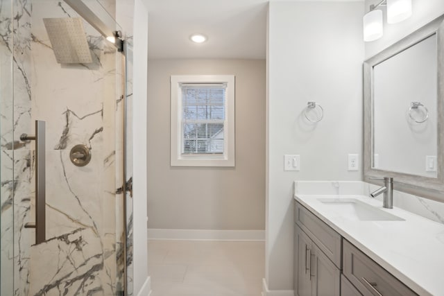 bathroom featuring a shower and vanity