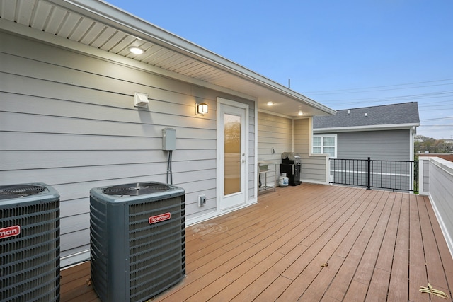 deck with grilling area and central AC unit