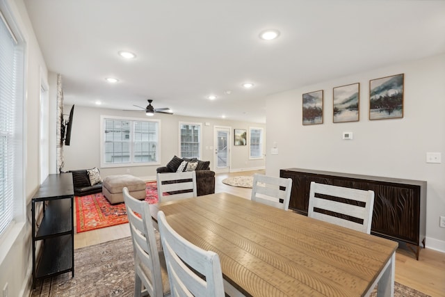 dining area featuring ceiling fan and wood-type flooring