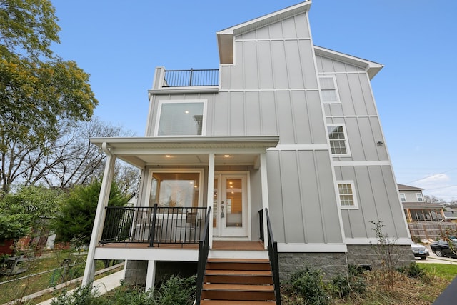 rear view of property featuring a porch