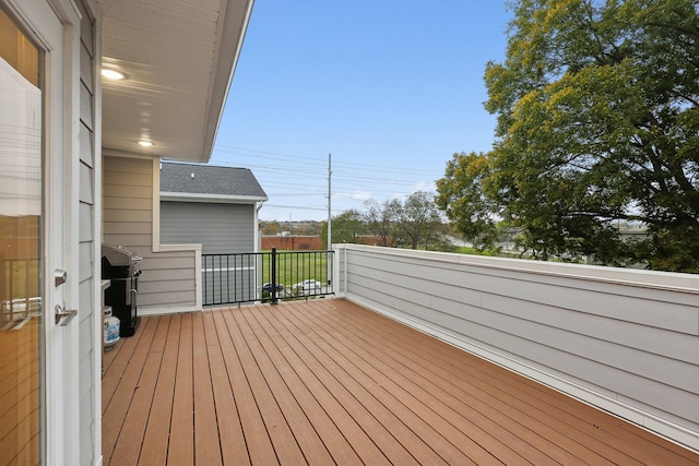 wooden terrace featuring area for grilling