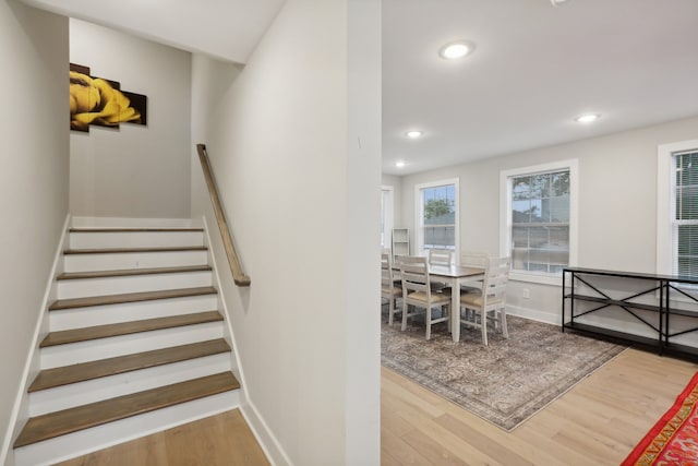 staircase with hardwood / wood-style floors