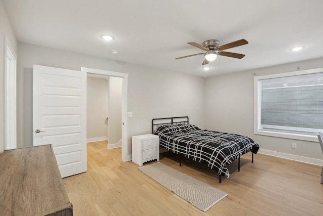 bedroom with ceiling fan and light hardwood / wood-style floors