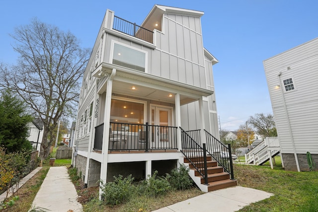 back of property featuring a porch