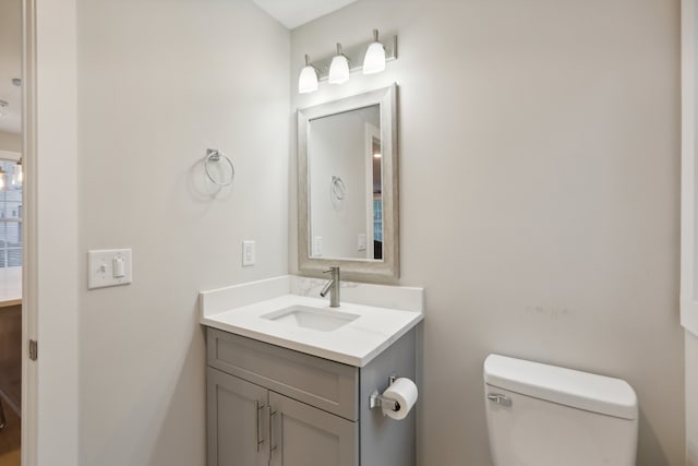 bathroom featuring toilet and vanity