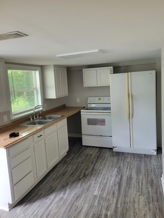 kitchen featuring white cabinets, dark hardwood / wood-style floors, white appliances, and sink