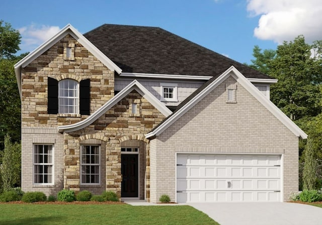 view of front of house with a garage and a front lawn