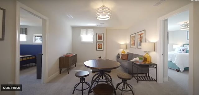 dining space with a healthy amount of sunlight and light carpet