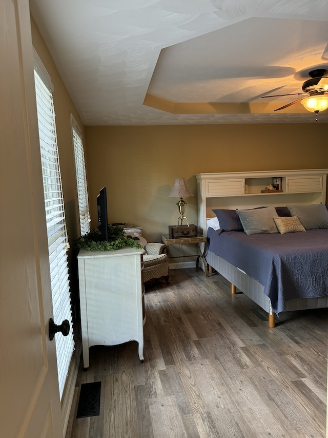 bedroom with hardwood / wood-style flooring and ceiling fan