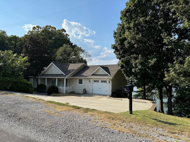 view of front facade with a porch and a garage