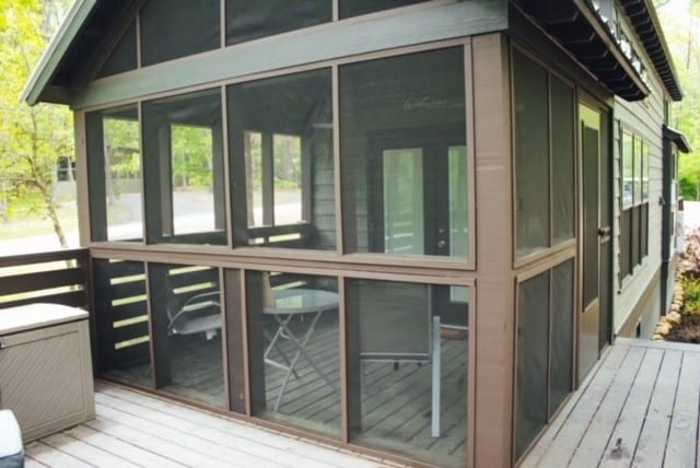 view of side of home with a sunroom