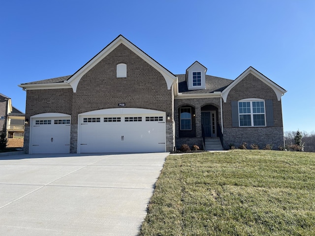 view of front of home featuring covered porch, a front yard, and a garage