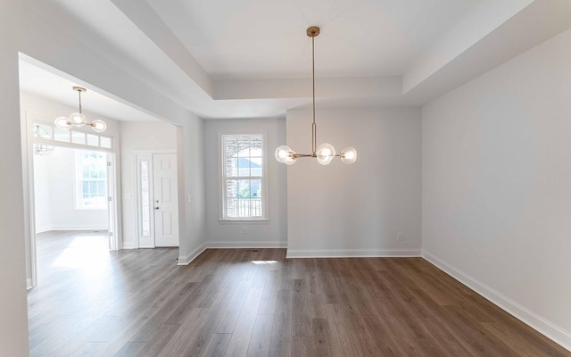 7938 Pine St, Fairview, TN 37062 - foyer with a chandelier, a tray ceiling, dark wood-style flooring, and baseboards