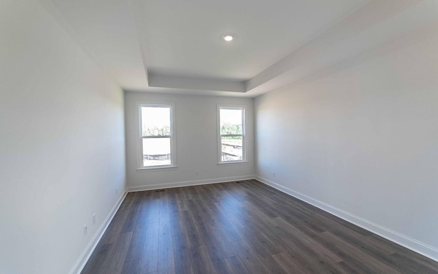 7938 Pine St, Fairview, TN 37062 - unfurnished room featuring baseboards, dark wood-style floors, a tray ceiling, and recessed lighting