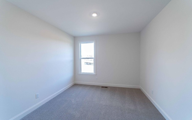 7938 Pine St, Fairview, TN 37062 - spare room featuring baseboards and light carpet