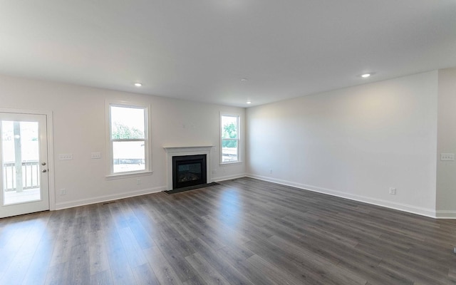 7938 Pine St, Fairview, TN 37062 - unfurnished living room with dark wood finished floors, baseboards, a fireplace with flush hearth, and recessed lighting