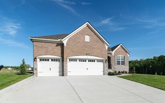 7938 Pine St, Fairview, TN 37062 - view of front facade with driveway, stone siding, a front yard, and an attached garage