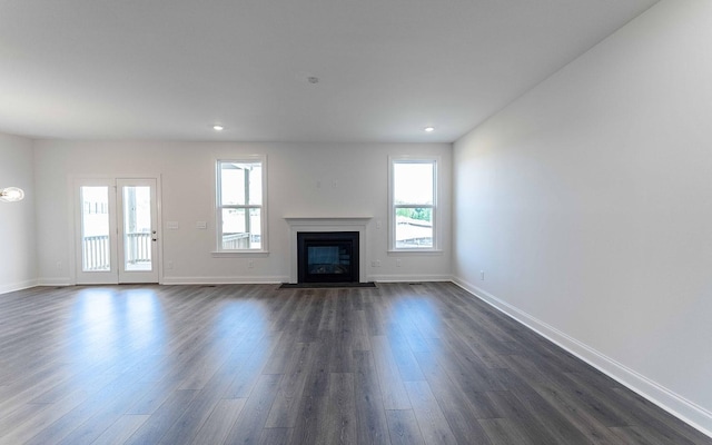 7938 Pine St, Fairview, TN 37062 - unfurnished living room with plenty of natural light, dark wood finished floors, baseboards, a fireplace with flush hearth, and recessed lighting