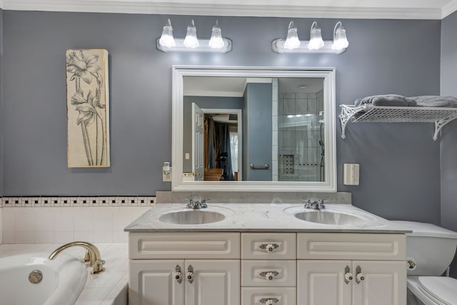 full bathroom featuring toilet, vanity, shower with separate bathtub, and ornamental molding