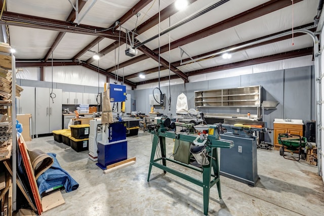 garage featuring a workshop area and a garage door opener