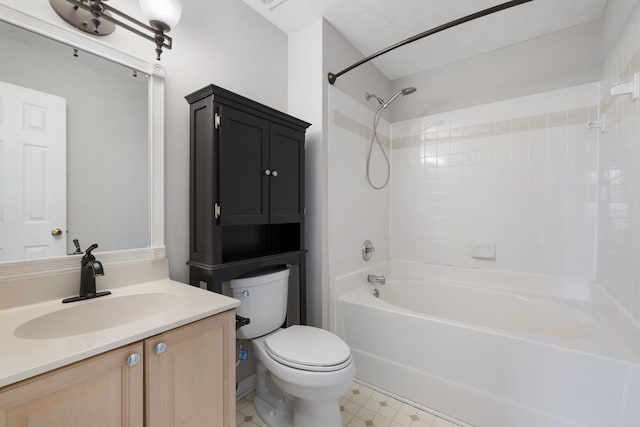 full bathroom featuring vanity, toilet, a textured ceiling, and tiled shower / bath combo