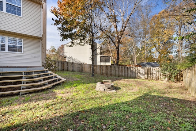 view of yard featuring a fire pit