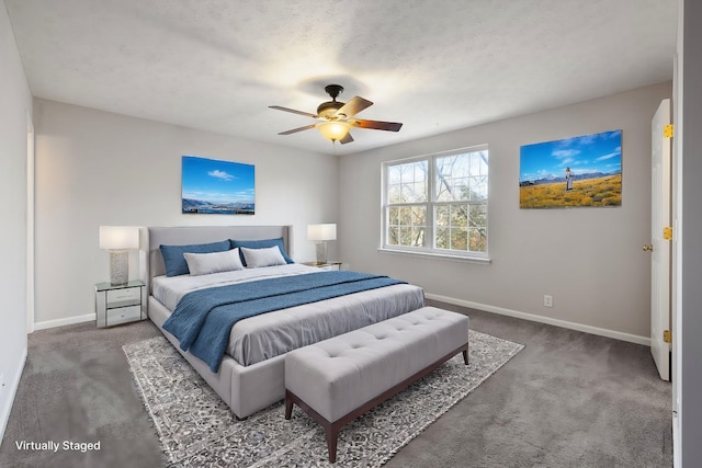 carpeted bedroom with ceiling fan and a textured ceiling