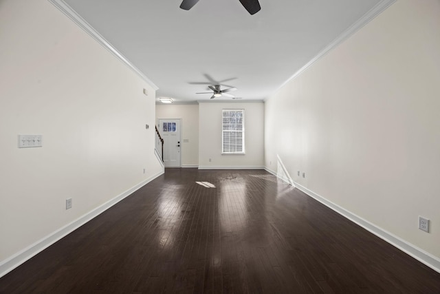 spare room featuring dark hardwood / wood-style floors, ceiling fan, and ornamental molding