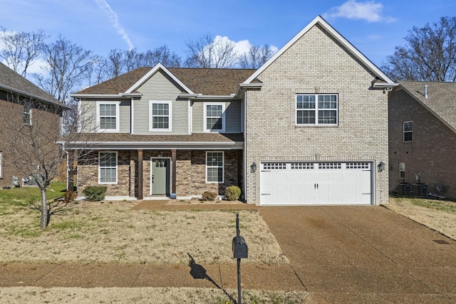 traditional-style house with a garage, cooling unit, concrete driveway, and brick siding