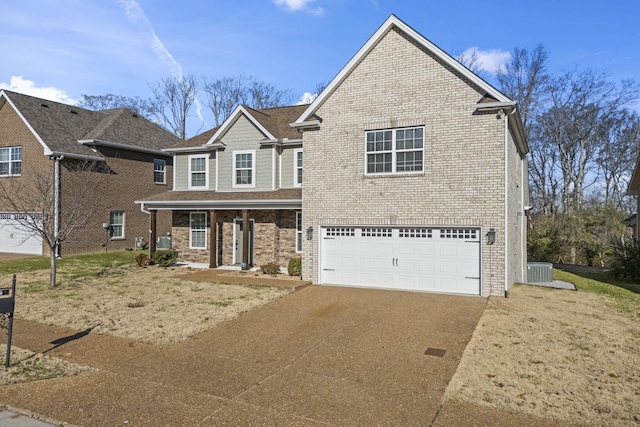 view of front of property featuring central AC unit and a garage