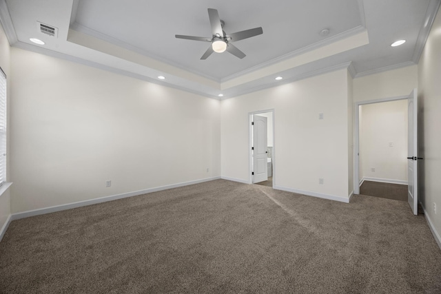 unfurnished room featuring carpet flooring, a tray ceiling, ceiling fan, and ornamental molding