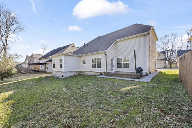 rear view of property featuring a wooden deck and a yard