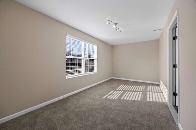 unfurnished room with carpet flooring