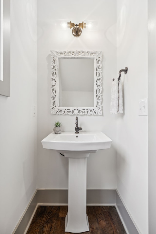 bathroom with hardwood / wood-style floors and sink