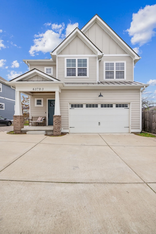 craftsman-style home featuring covered porch and a garage