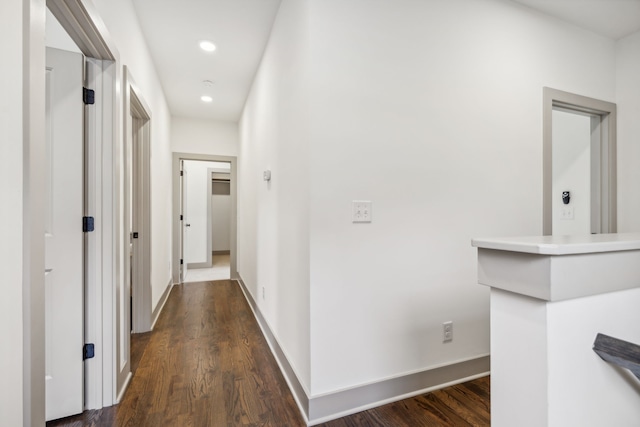 corridor featuring dark hardwood / wood-style flooring