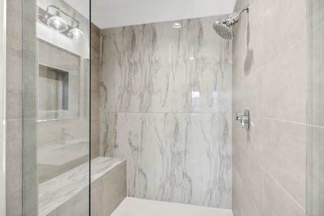 bathroom featuring tiled shower