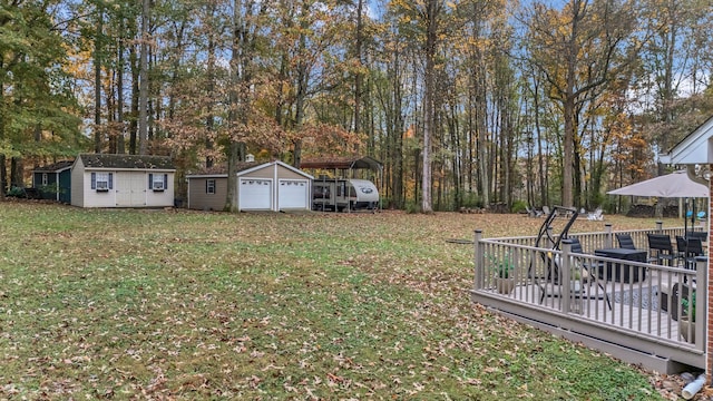 view of yard with a shed and a deck