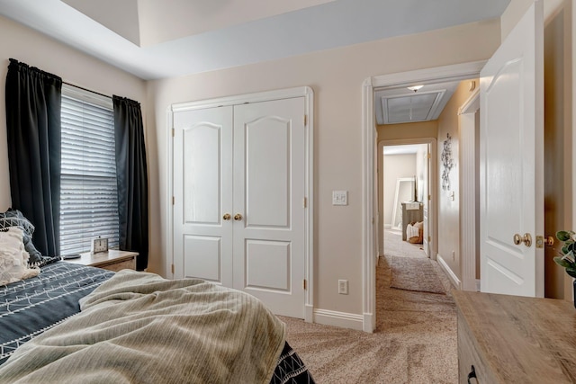 carpeted bedroom with a closet