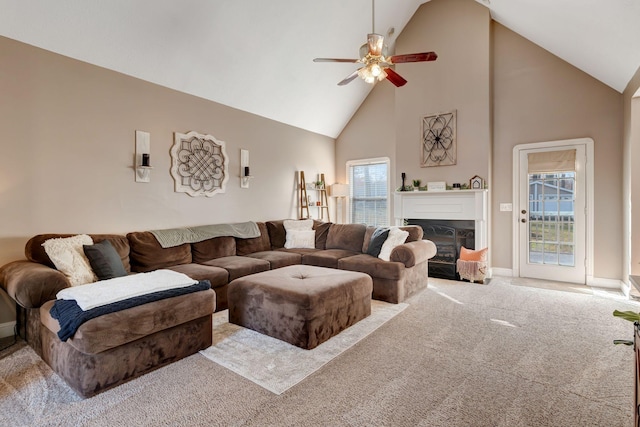 living room featuring ceiling fan, light carpet, and high vaulted ceiling