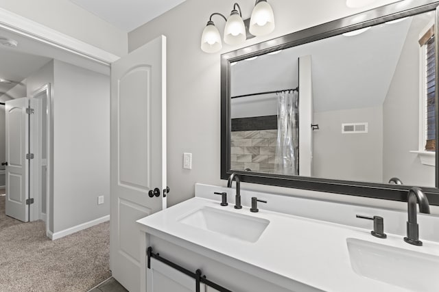 bathroom with curtained shower and vanity