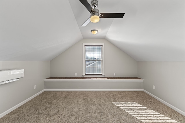 additional living space featuring carpet floors, ceiling fan, and lofted ceiling