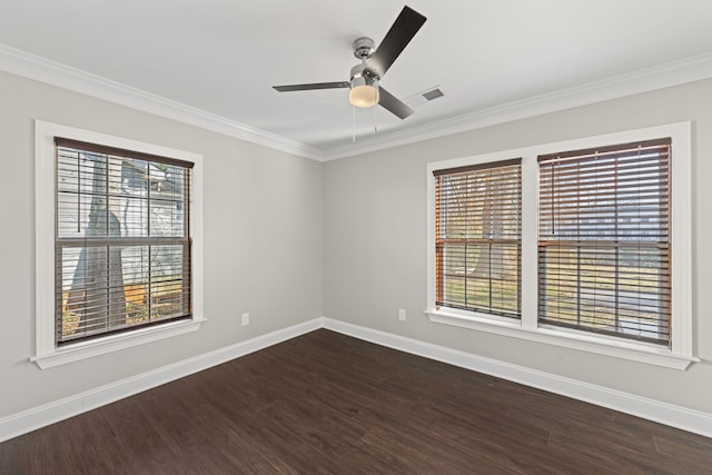 unfurnished room with dark hardwood / wood-style floors, a wealth of natural light, and ornamental molding