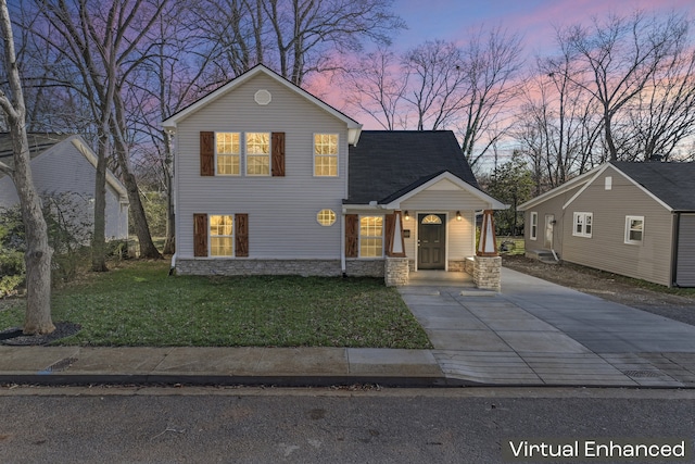 view of front of house with a lawn