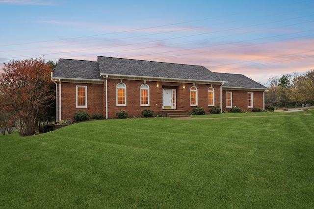 ranch-style house with a yard