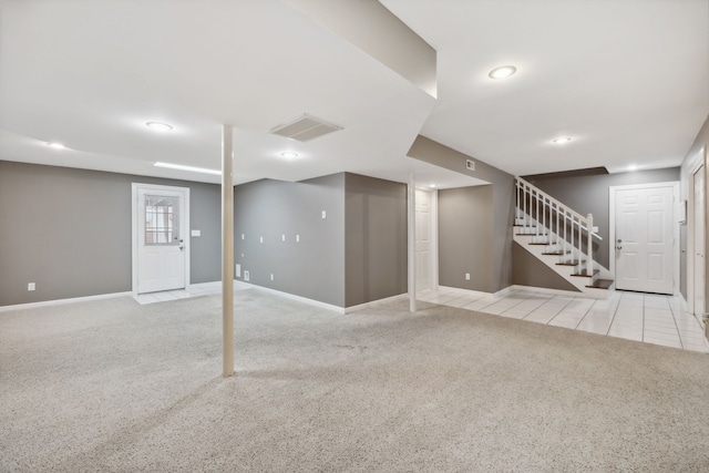 basement with light colored carpet