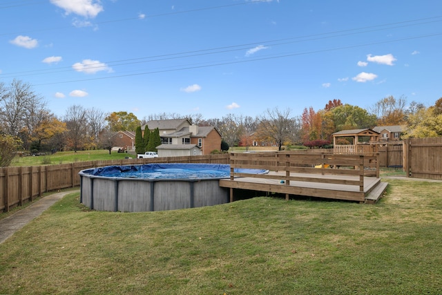 view of yard featuring a swimming pool side deck